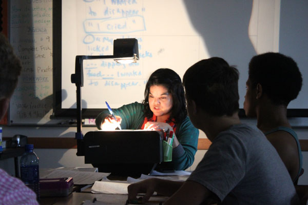 English teacher Sarah Martin teaches using old school projector.