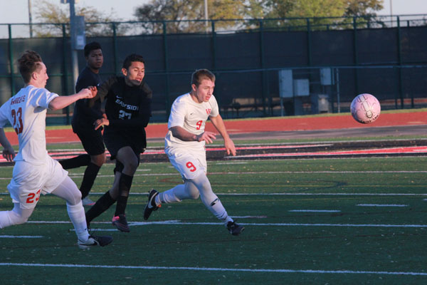 Boys soccer keeps marching after first playoff win