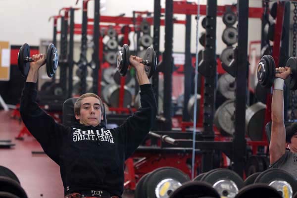 Junior Captain Grayson Holmes works out with his teammates.