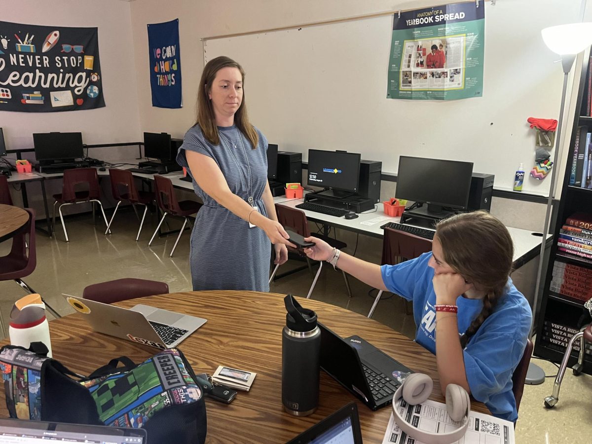 Mrs. Dossey takes a student's phone during her lesson due to not listening and hiding the device instead of putting it away. When students don't follow the rules, teachers have to take matters into their own hands and completely take up their phones.