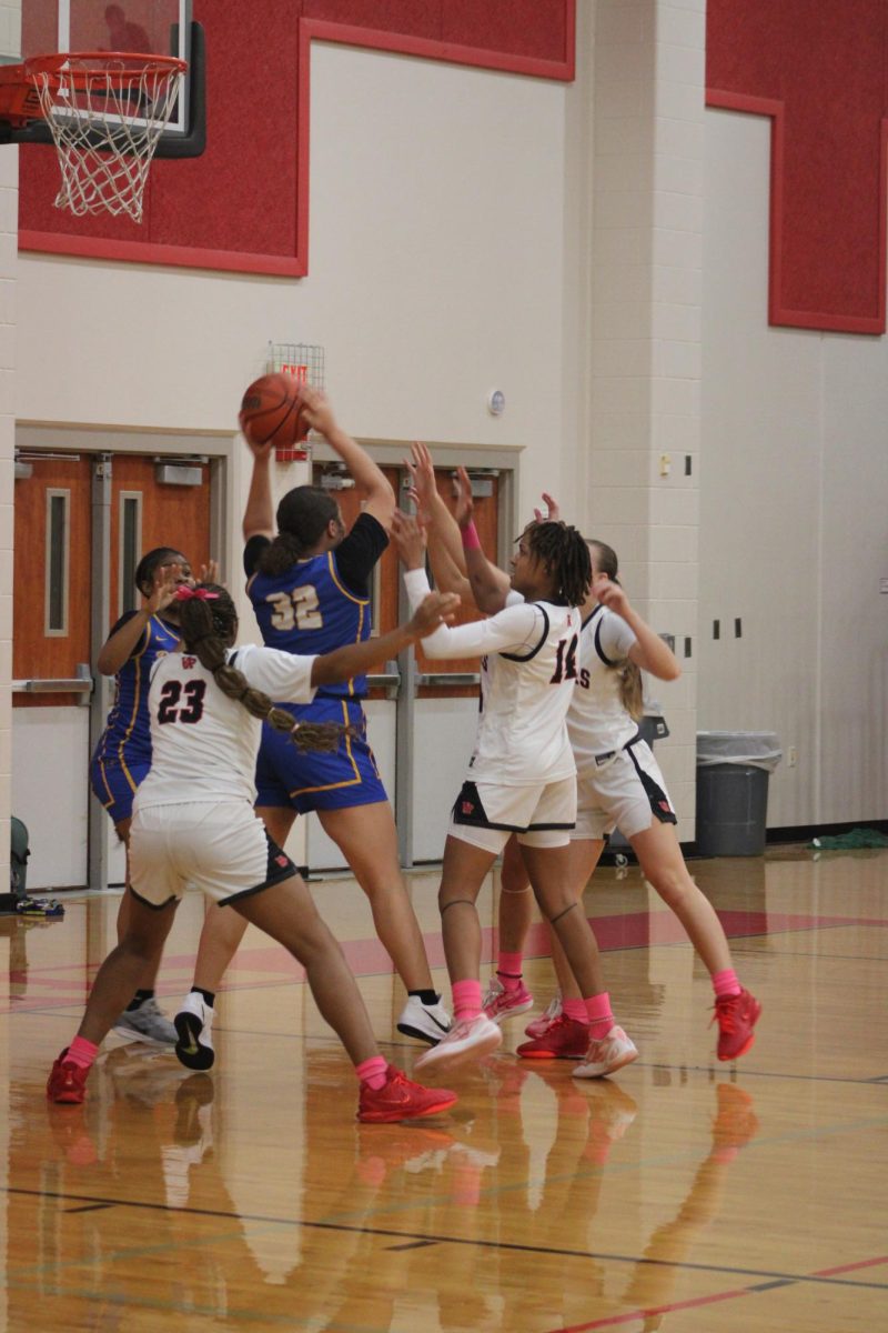 Vista varsity girls are trying hard to get the ball back.