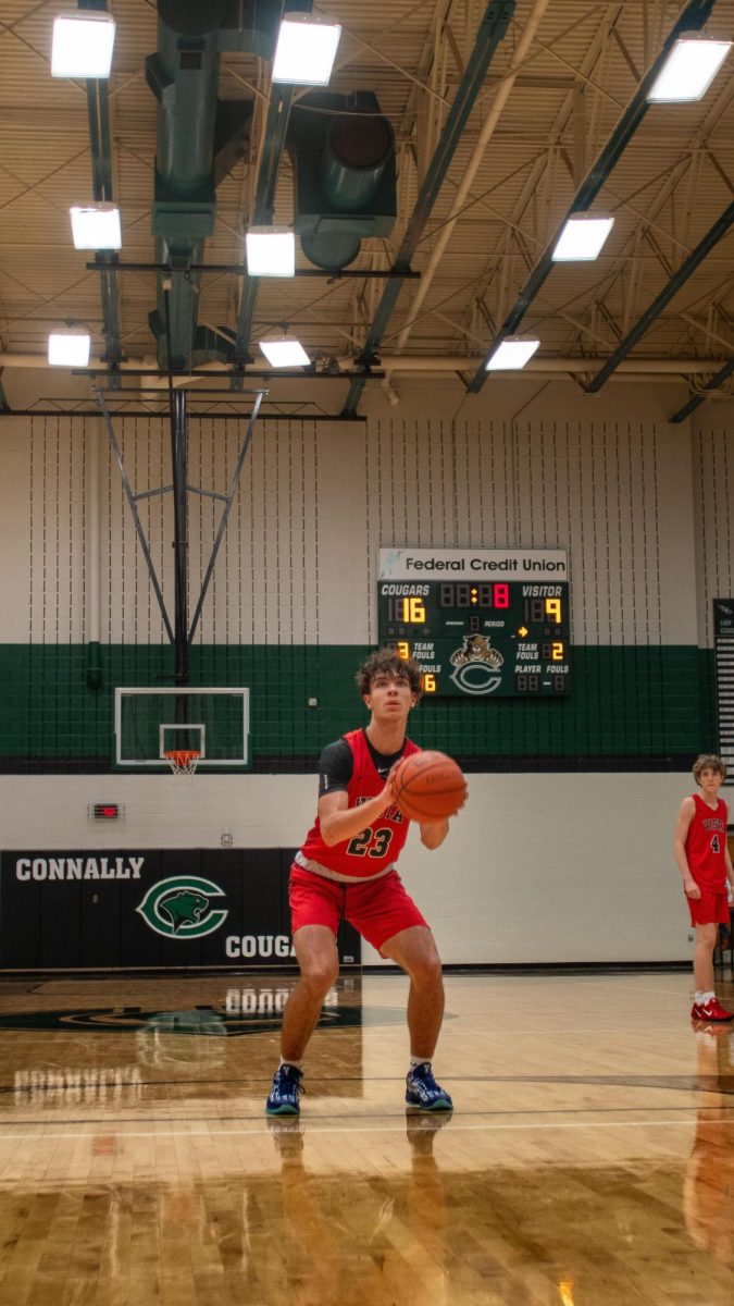 Junior Power Forward Jack Keller staying low to making his shot swaying away against Connally.