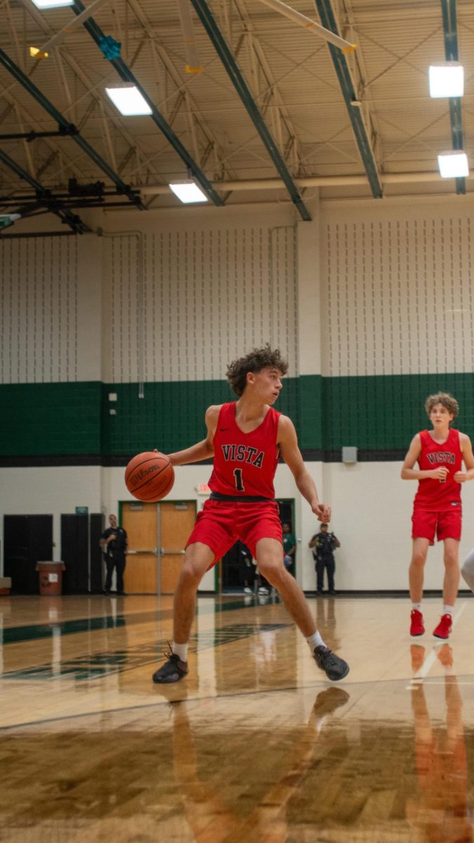 Junior Point Guard Cayden Sneed keeps the ball in possession to make a play against Connally. 